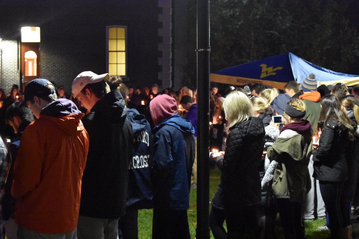 David Rusko gather in Woodburn Circle during a prayer vigil held on Nov. 12, 2018